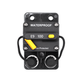 Top-down view of 100A waterproof circuit breaker with rubber stud covers installed