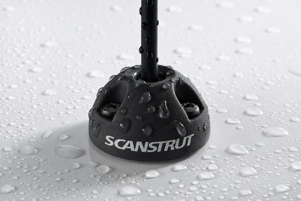 Water droplets on a black Scanstrut cable seal demonstrating its waterproof rating