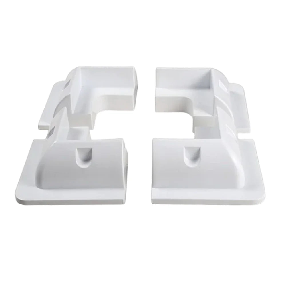 Set of four white ABS plastic corner brackets for solar panel mounting arranged in a square