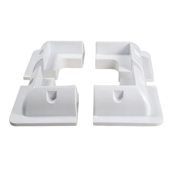 Set of four white ABS plastic corner brackets for solar panel mounting arranged in a square