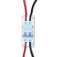 Front view of wired 2-pole DC circuit breaker with red and black cables connected to terminals