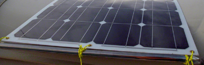Solar panel with eyelets installed onto canvas