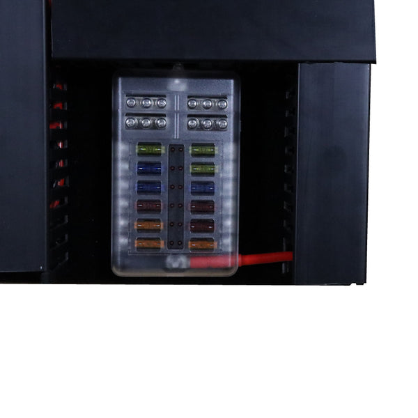 Close-up of transparent 12-way fuse block with various coloured automotive fuses