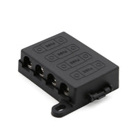 Angled view of black 4-way midi fuse holder with protective cover and mounting tabs