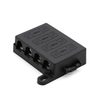 Angled view of black 4-way midi fuse holder with protective cover and mounting tabs