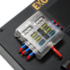Close-up of 6-way fused busbar with 15A and 20A fuses under clear cover