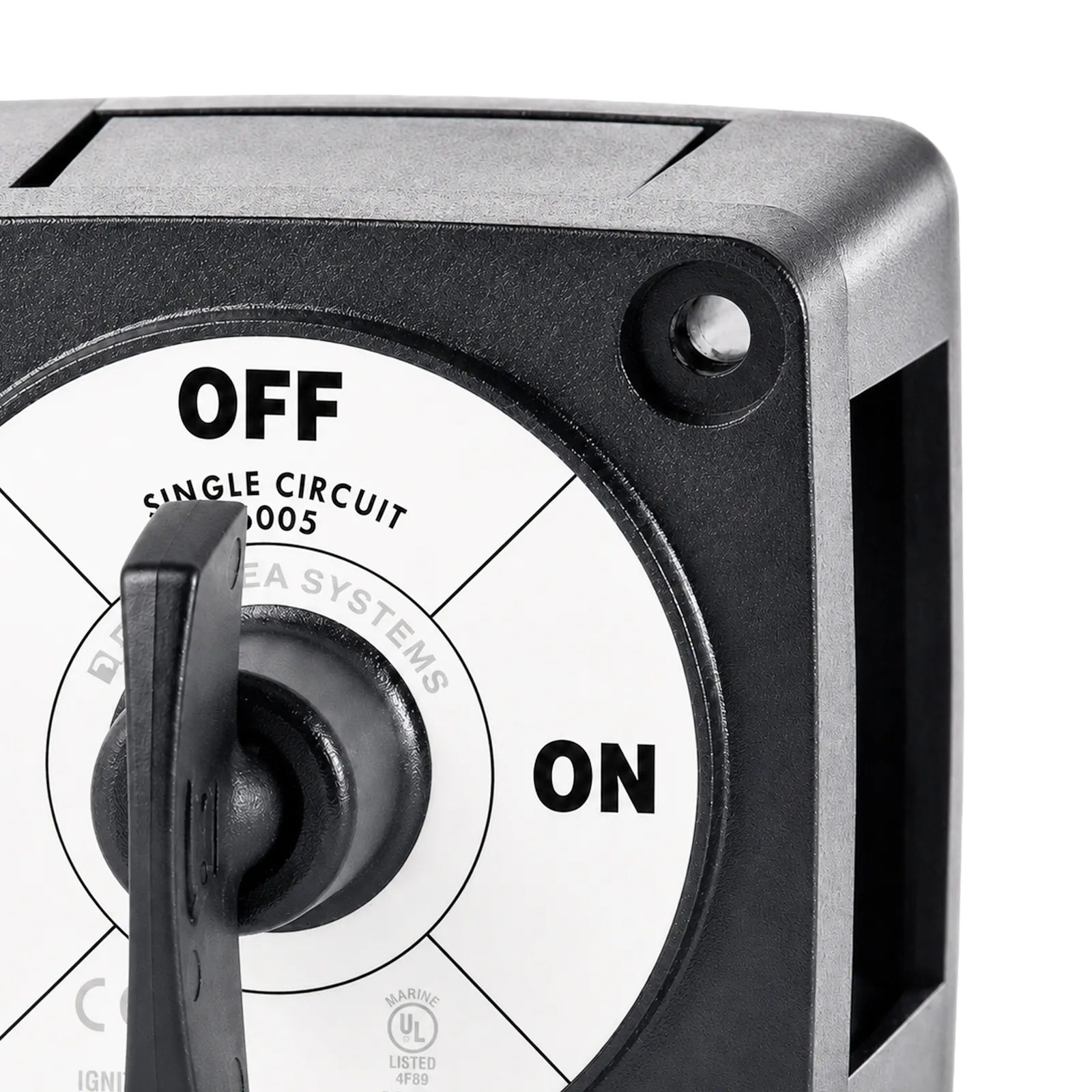 Close-up of the mounting hole and faceplate labelling of the battery switch