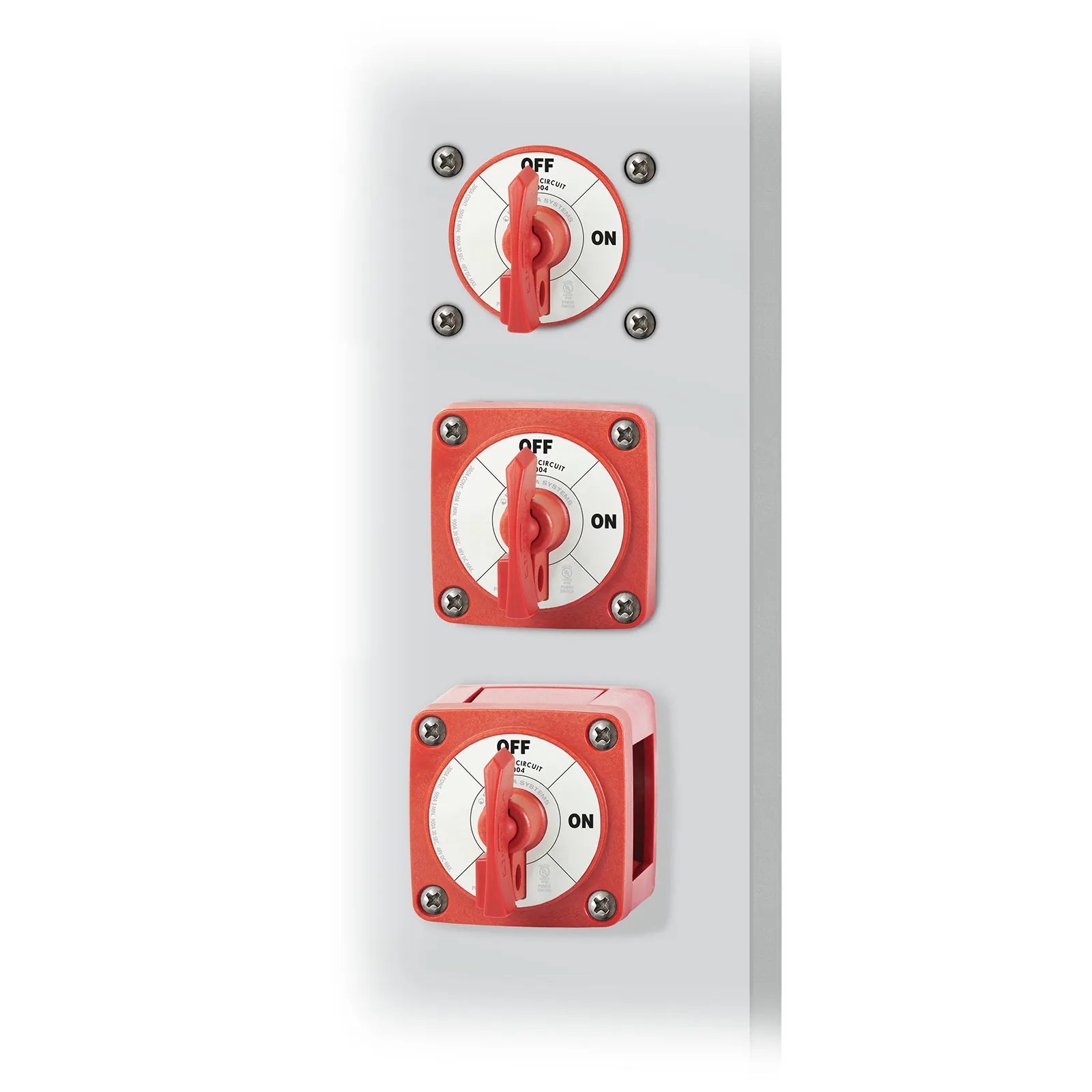 Three red battery switches shown in different mounting configurations on a panel