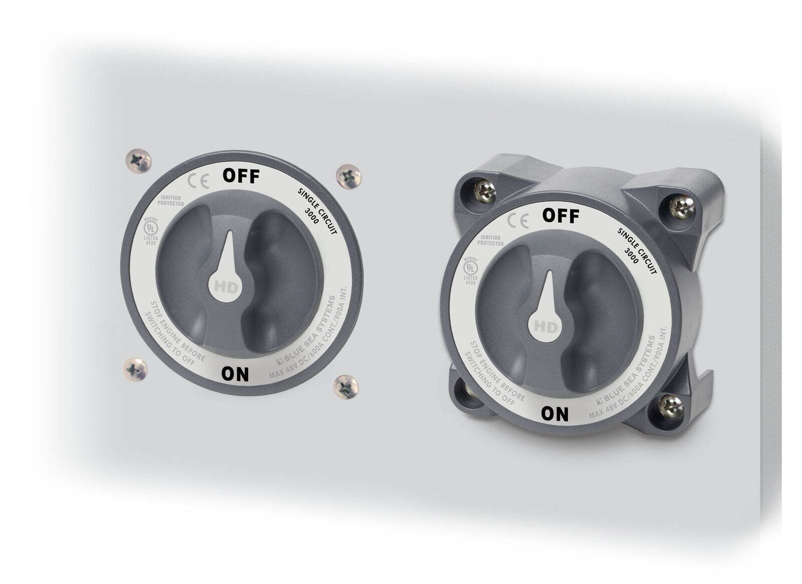 Two Blue Sea HD-Series battery switches mounted side-by-side on a white panel