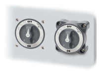 Two Blue Sea HD-Series battery switches mounted side-by-side on a white panel