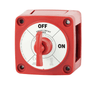 Angled view of red marine battery switch with removable key selector in OFF position and visible side knockouts