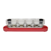 Red busbar with clear polycarbonate cover installed protecting terminals