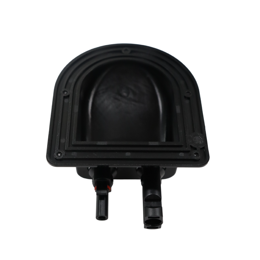 Underside of black plastic housing showing internal cavity and mounting flange