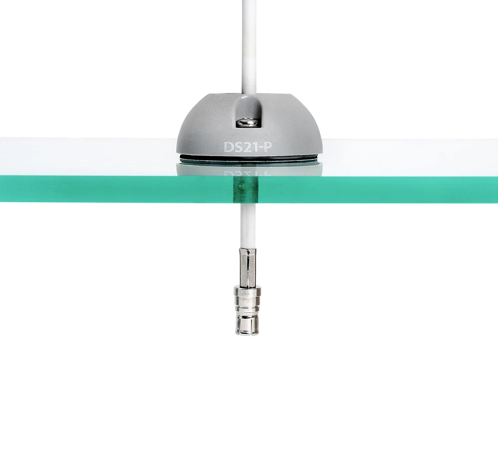 Side view of grey cable seal on glass surface showing cable connector passing through
