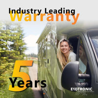 Woman driving a campervan with text overlay highlighting a 5-year industry-leading warranty