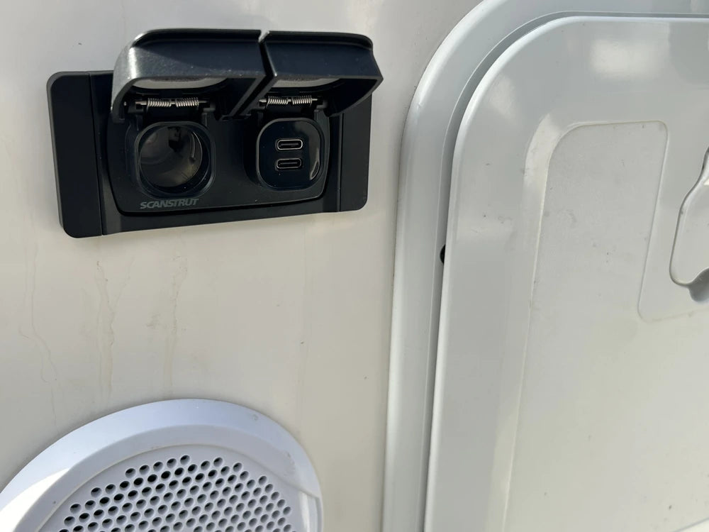 Scanstrut Flip Pro Multi installed on a white caravan exterior wall