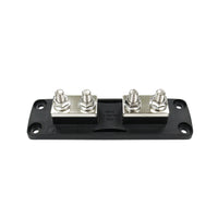 Top view of fuse block showing copper mounting blocks and four terminal studs