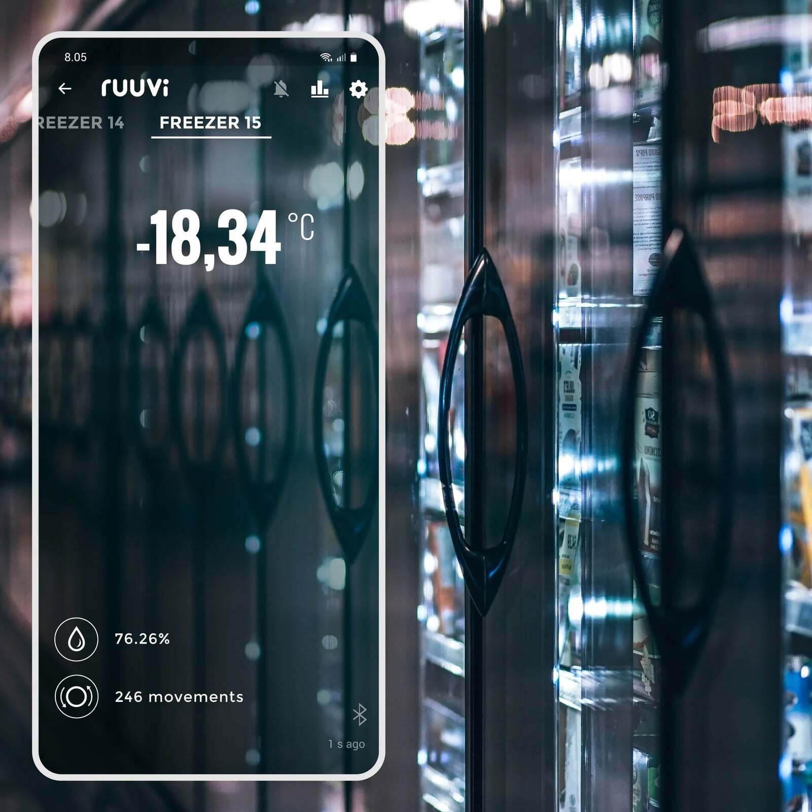 Smartphone displaying Ruuvi app with minus 18 degree reading in front of glass door commercial freezers