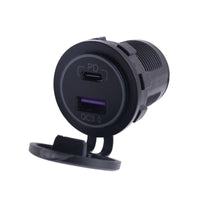 Front view of black dual USB socket with open cap showing USB-C PD and USB-A QC3.0 ports