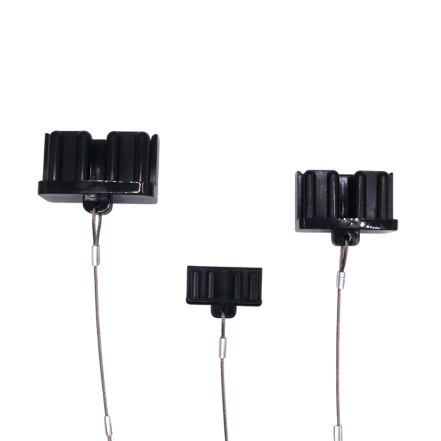 Multiple angles of black plastic dust cap showing internal prongs and external ribs