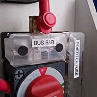 Electrical panel installation showing bus bar and battery switch in a marine or caravan context