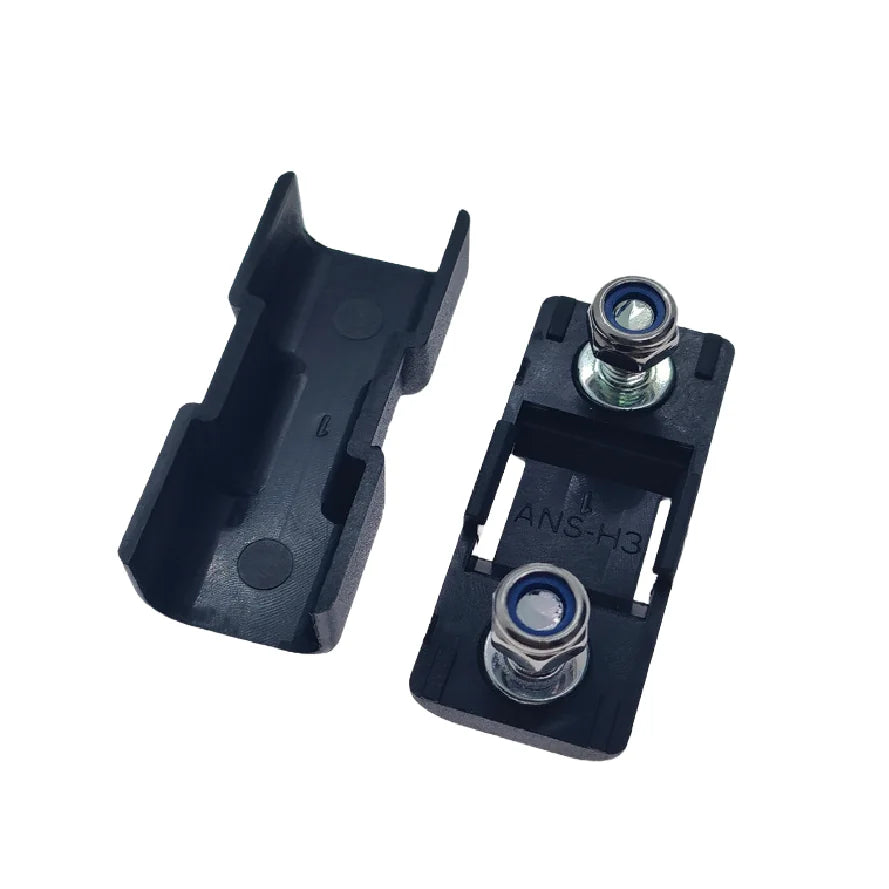 Open fuse holder showing internal cover ribs and base with ANS-H3 moulding and studs