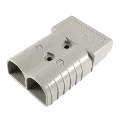 Top angled view of grey Anderson plug housing detailing mounting holes and polarity signs