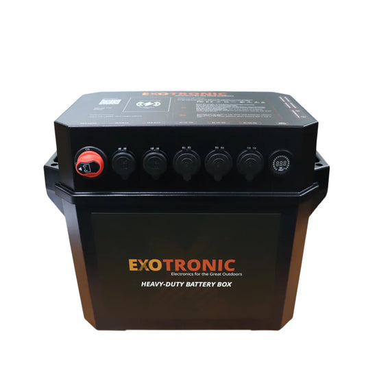Front view of black battery box with red master switch, digital voltage display, USB ports, and 12V sockets