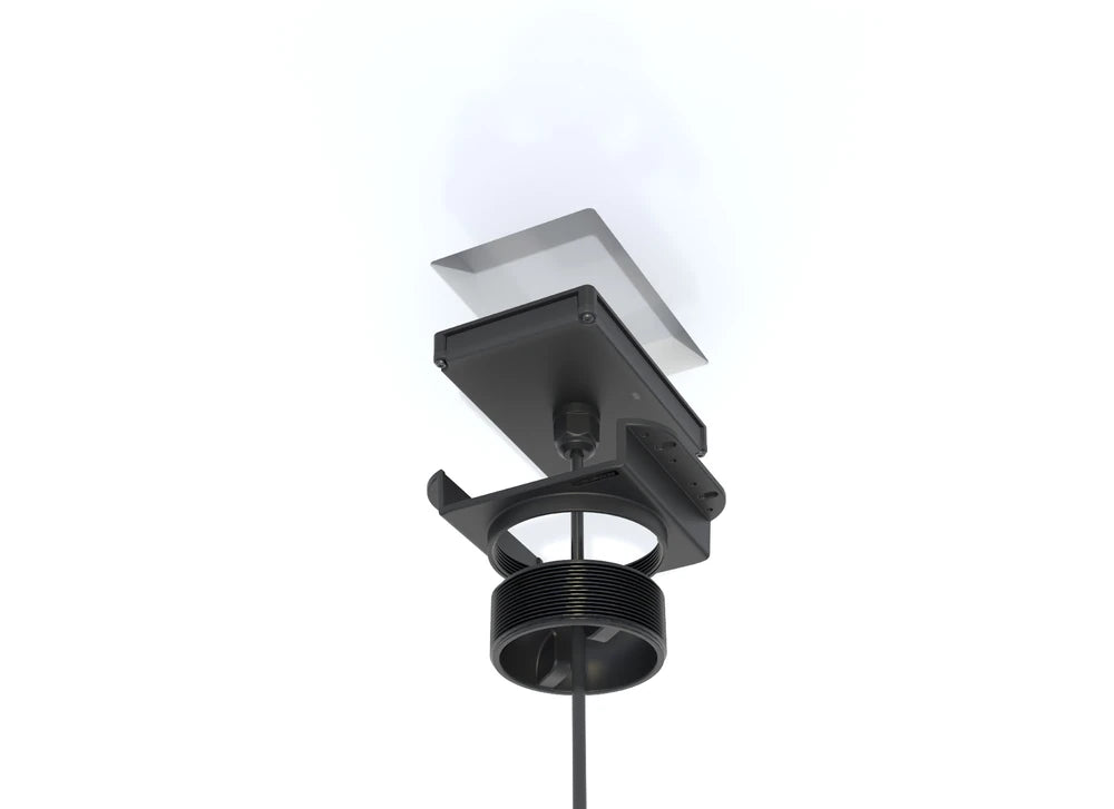 Exploded view showing wireless charger unit, mounting bracket, and compression puck components