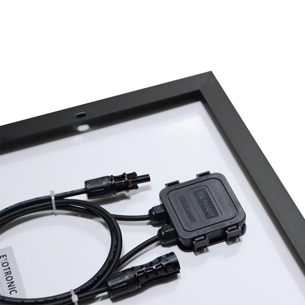 Close-up of IP68 rated junction box with MC4 compatible connectors on rear of panel