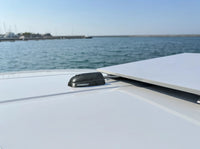 Marine cable seal installed on a white deck in a coastal environment