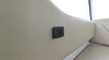 USB-C socket installed on a cream textured marine interior wall panel