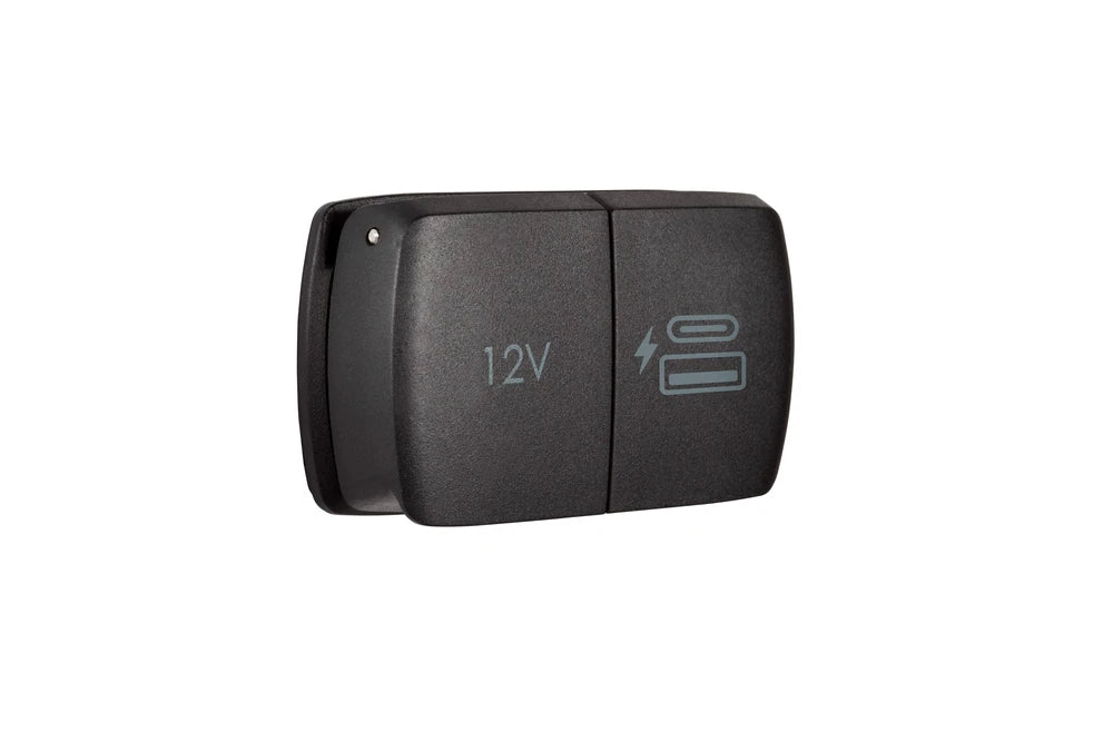Angled front view of dual power socket showing 12V and USB icons on closed lids