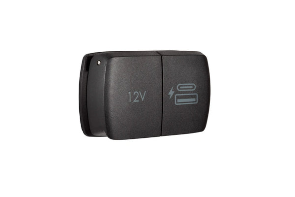 Angled front view of dual power socket showing 12V and USB icons on closed lids