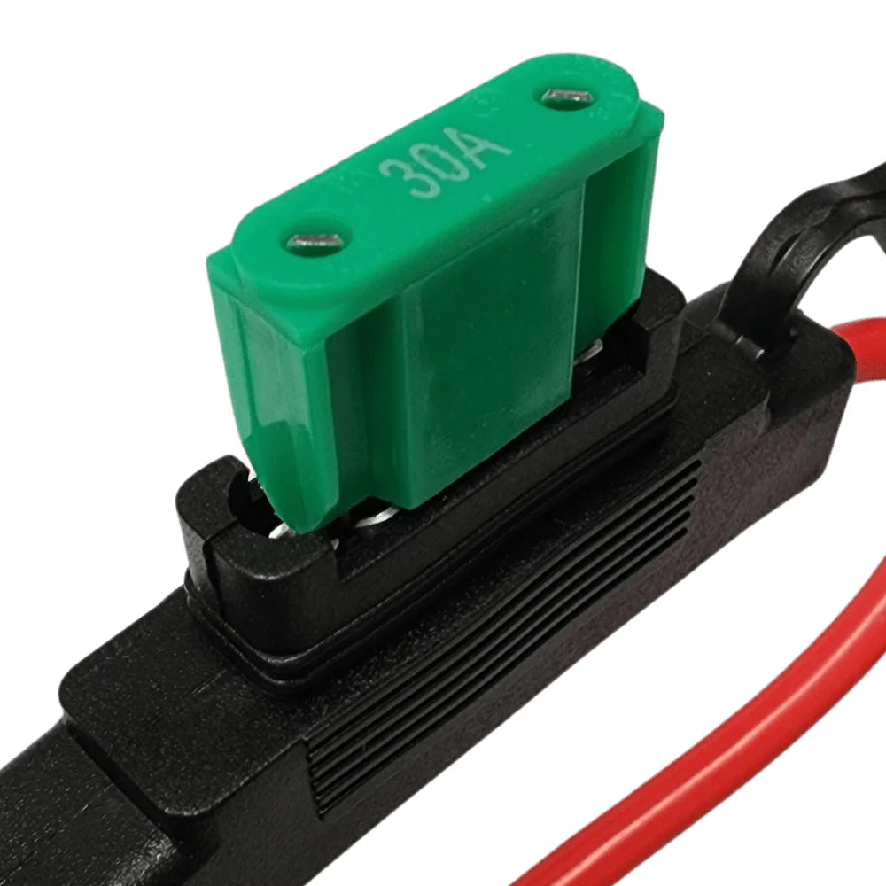 Green 30A maxi blade fuse being inserted into Exotronic fuse holder