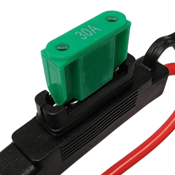 Green 30A maxi blade fuse being inserted into Exotronic fuse holder