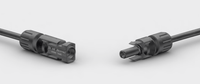 Male and female MC4 connectors facing each other with safety warning text visible