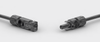 Male and female MC4 connectors facing each other with safety warning text visible