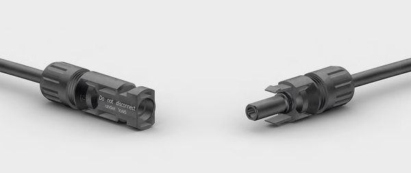 Male and female MC4 connectors facing each other with safety warning text visible