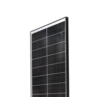 Close-up of solar panel top corner showing cell grid and glass texture