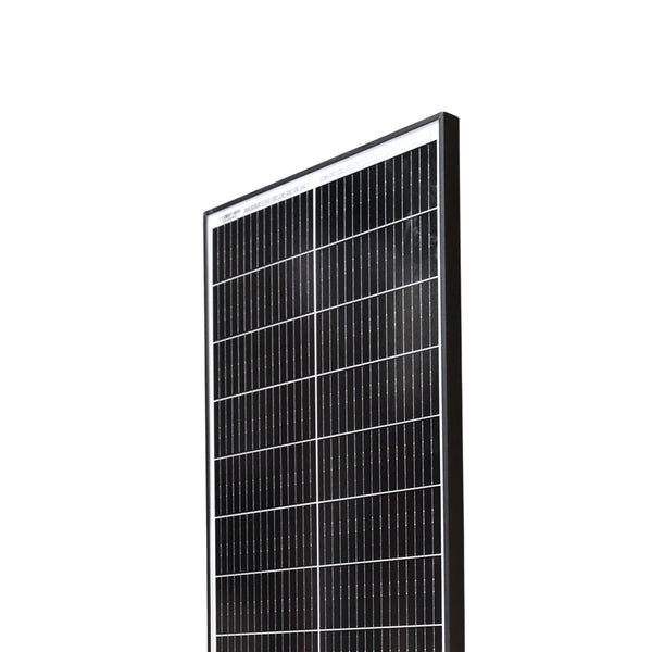 Close-up of solar panel top corner showing cell grid and glass texture