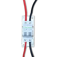 Top-down view of circuit breaker with red and black cables connected to terminals