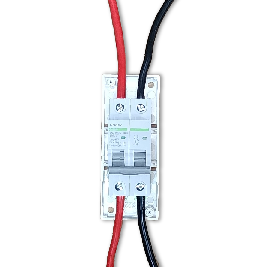Top-down view of Noark DC circuit breaker wired with red positive and black negative cables