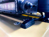 Close-up of cable seal on a vehicle roof routing power to an LED light bar