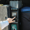 Hand operating the Simarine touch screen battery monitor on an Adventurer power system