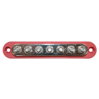 Overhead view of red busbar showing seven tin-plated copper studs and mounting holes