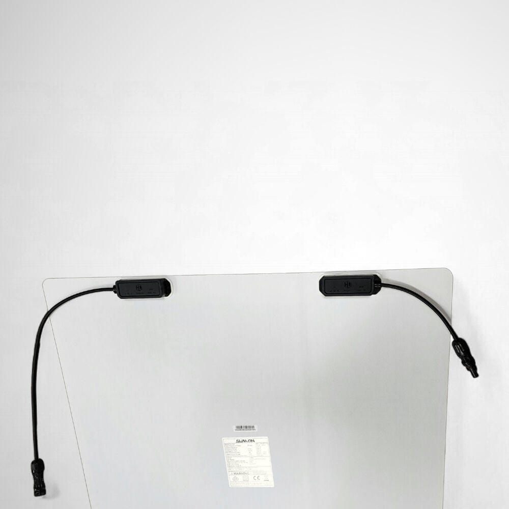 Underside of Sunman solar panel showing rear-mounted junction boxes and cables