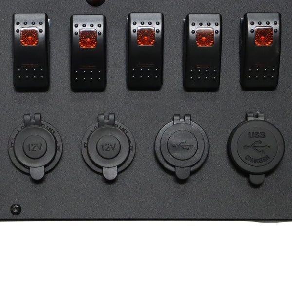 Close-up of rocker switches and waterproof caps on 12V and USB sockets