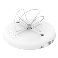 Angled view of white circular gateway with embossed logo and wire cloverleaf antenna