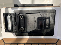 Scanstrut ATMOS air pump installed with door open showing inflate and deflate ports